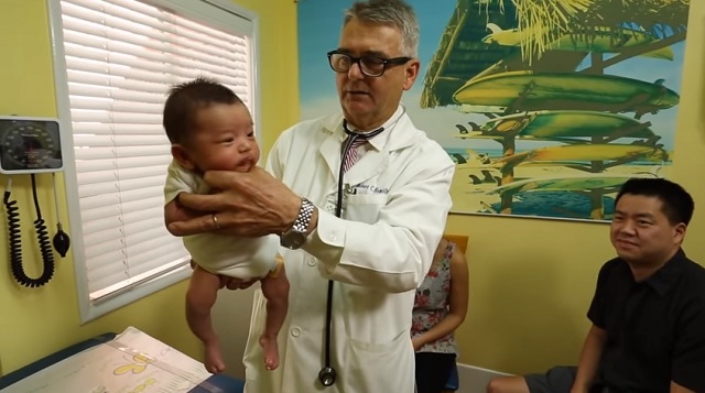 A pediatrician demonstrates how to soothe a crying baby