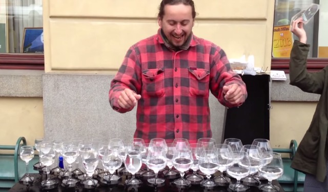 He arranged some glasses filled with water on a table; watch what he’s doing - it's wonderful