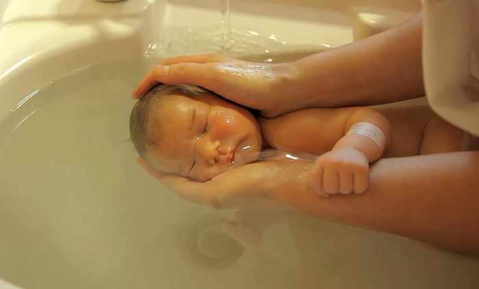 The nurse's bathing technique had worried the mother until she saw the newborn's reaction